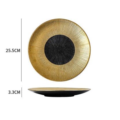 Decorative plate with gold rim and black center, showing measurements on a white background